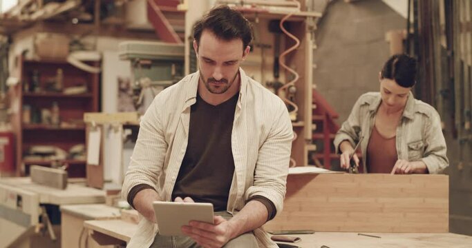 Man, tablet and small business or carpentry workshop with internet connection. Male carpenter with technology for planning, website or social media ideas for creative furniture project or development