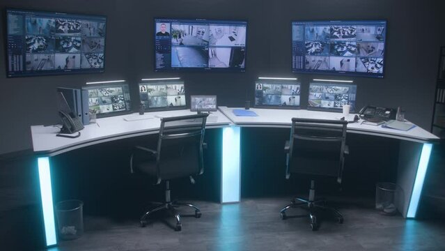 Workspace in modern security control center for monitoring CCTV cameras with AI facial recognition system. Computer monitors, tablet and big digital screens showing surveillance cameras video footage.