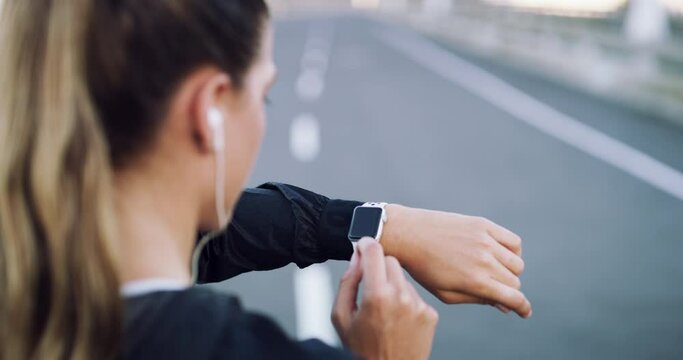 Running, smart watch and hand of woman in city for fitness tracker, health app and cardio performance. Check, workout and exercise with female runner on highway road for sports, training and progress