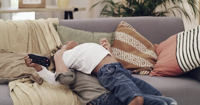 Children, gaming and brothers fight in competition while playing a video game in the living room. Friends, gamer and conflict with kids having fighting on a sofa in the home for sibling rivalry