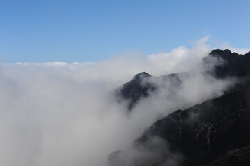 Fototapeta na wymiar Clouds over mountains in Madeira island, Portugal