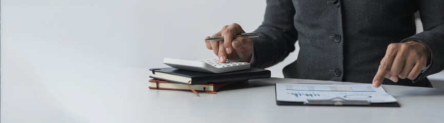 copy space, banner, panorama business woman working on the table Point to the data graph from the...