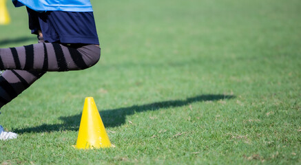 Football player running training on the soccer field