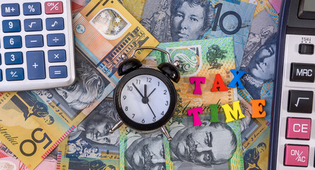 Australian dollars with clock and 'tax time' text