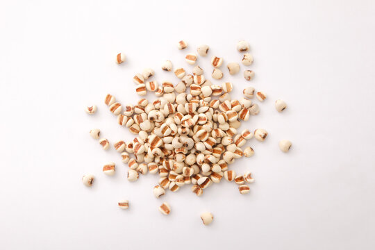 Pile of Job's tears or adlay millet seeds isolated on white background , top view , flat lay.