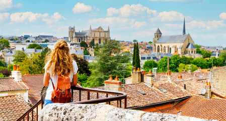 Poitiers city landscape viewpoint- Woman tourist looking at city skyline- vacation, travel destination, tourism in France- Poitou Charente, Vienne - obrazy, fototapety, plakaty