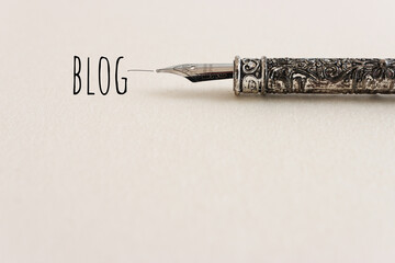 Vintage ink pen and the word blog. Concept of communication and social media
