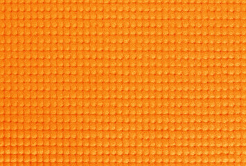 Orange yoga mat texture, pattern of rubber for background.