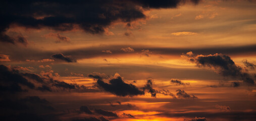 Sunset sky with orange clouds. Nature background.