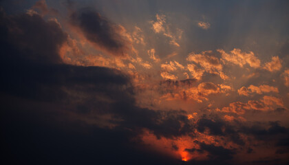 Sunset sky with orange clouds. Nature background.