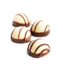 Sweet chocolate pralines.  Tasty chocolate truffles isolated on white background.