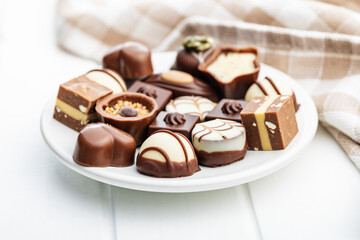 Sweet chocolate pralines.  Tasty chocolate truffles on plate.