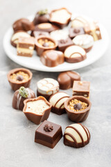 Sweet chocolate pralines.  Tasty chocolate truffles on kitchen table.