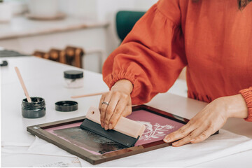 Fashion designer doing fabric printing at workshop