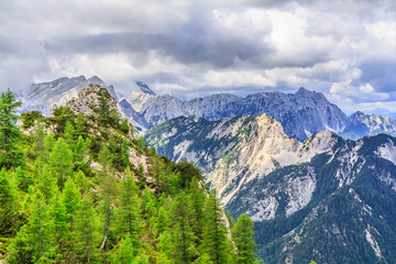 View from the trail to Špik (2,472 m) in Julian Alps (Slovenia): in the foreground, the Prednje and Zadnje Robičje (1,960 m) range, behind them the Visoka Ponca (2,274 m) range.