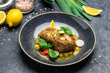 fish fillet breaded in nuts with pepper sauce and vegetables, Healthy fats, clean eating for weight loss, Ketogenic diet food. Restaurant menu, dieting, cookbook recipe top view