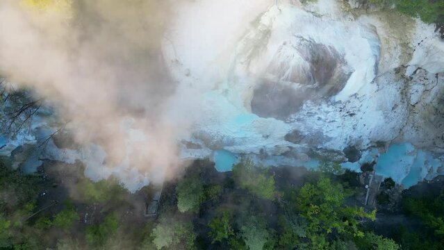 This aerial drone video shows the Bagni San Filippo. It is a hot spring which can be found in Tuscany, northern Italy. The relaxing hot springs are free to visit and have really hot water. 