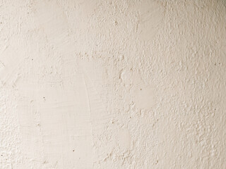 Old wall painted white close-up. A plaster wall texture. Light abstract background.