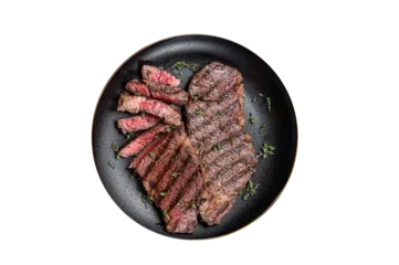  Barbecue denver strip beef meat steak on a plate.  Isolated, transparent background. © Vladimir