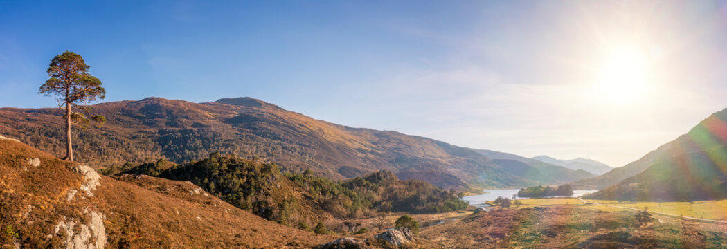 UK, Scotland, Panoramic view of sun shining over Glen Cannich