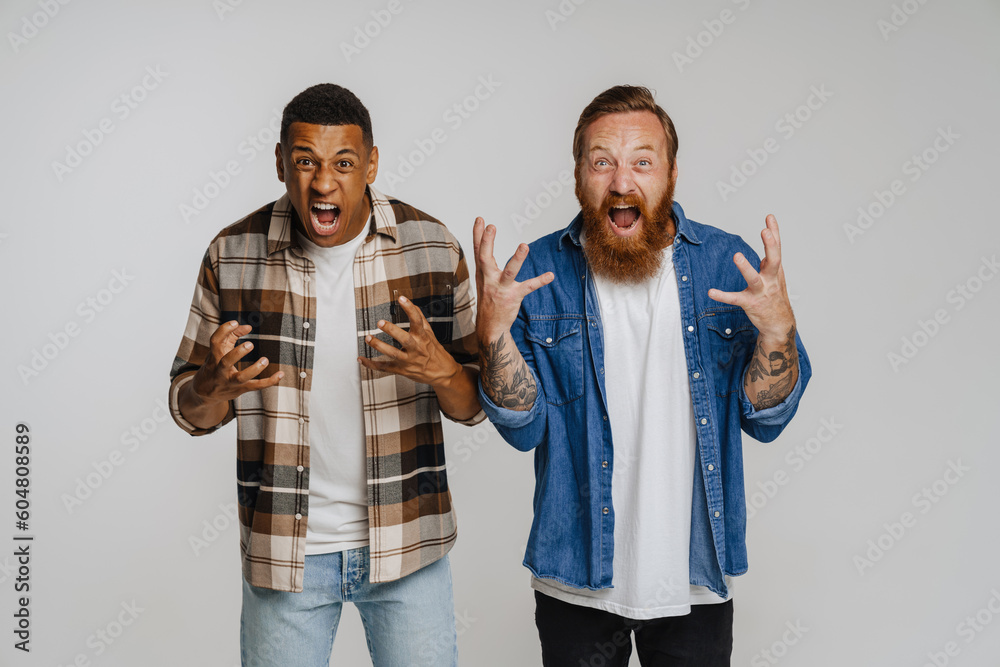 Wall mural Two excited men screaming and gesturing with thrill