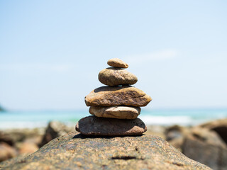 Stack Stone Pebble Growth on Blur Sea Background,Concept Spiritual Stability Zen
