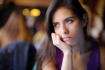 Bored woman waiting in a restaurant