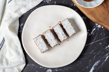 Coconut and chocolate cookies. Delicious cookies on dark background. Top view