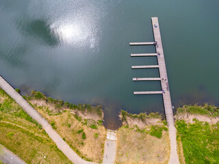 Aerial view landscape. View of wooden path, pier, lake, pond. Poland Przylasek Rusiecki.