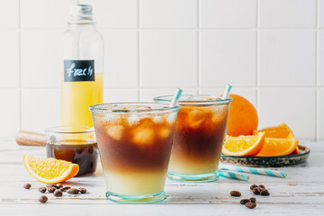 Trendy summer seasonal refreshing drink Bumble coffee on white background. Cold coffee recipe.