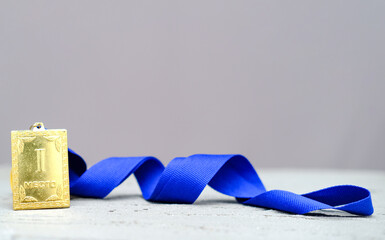 Square Gold medal for the first 1st place with a blue ribbon, the concept of leadership and leadership, victory