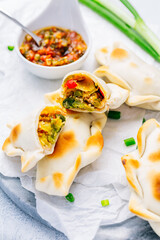 Vegetable empanadas with chimichurri sauce. Latin American cuisine.