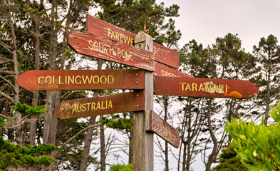 Signpost at the extreme northern tip of the South Island of New Zealand.