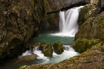 Waterfall with mossy rocks in mountain canyon, Svrakava waterfall near Banja Luka