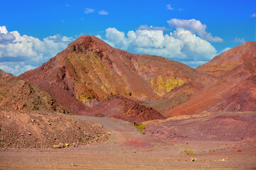 Colorful mountains. Sandstone in desert. View from car