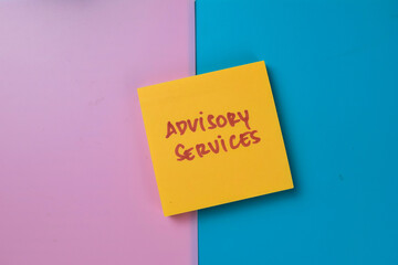 Concept of Advisory Services write on sticky notes isolated on Wooden Table.