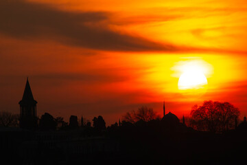 Fototapeta premium Mosque minaret silhouette at sunset time.