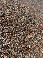 Natural sea pebbles, wet pebbles, small pebble background
