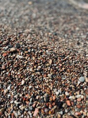 Natural sea pebbles, wet pebbles, small pebble background
