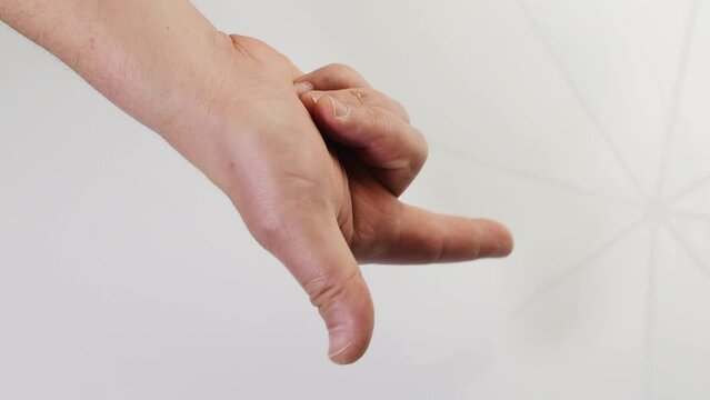Man demonstrate how to make the italian gesture that stands for: nothing