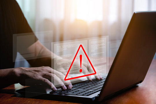 Computer laptop with triangle warning sign for error notification and maintenance concept. warning virus detected computer bug software bug