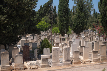 Gravestones and graves at jewish  cemetery. Graves background. in Israel at the outskirts of Tel...