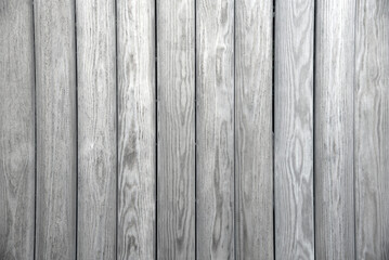 White grey colored old vintage wood with vertical boards. Grunge wooden background. Shabby chic France Provence style.