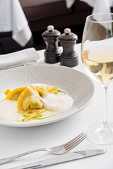 Tasty cooked ravioli with cream sauce