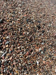 Natural sea pebbles, wet pebbles, small pebble background