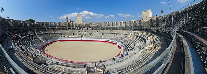 Arles, May 2023 : Visit the beautiful city of Arles en Provence - Historical city with its arena and ancient theater - View on the arena - obrazy, fototapety, plakaty