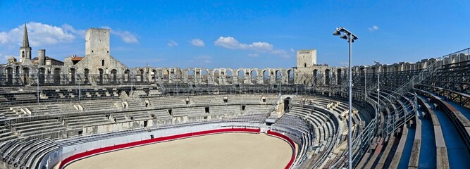 Arles, May 2023 : Visit the beautiful city of Arles en Provence - Historical city with its arena and ancient theater - View on the arena - obrazy, fototapety, plakaty