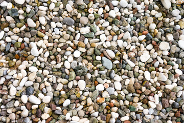 Close-up of the pebble beach. Pebbles as a background.
