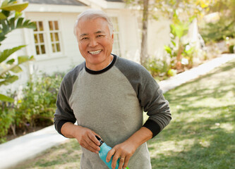Smiling older man carrying water bottle