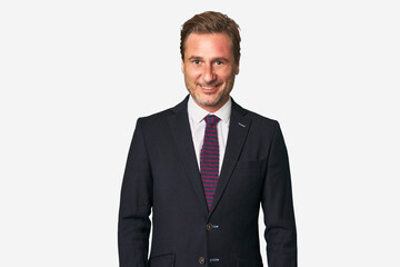 A middle-aged businessman isolated happy, smiling and cheerful.